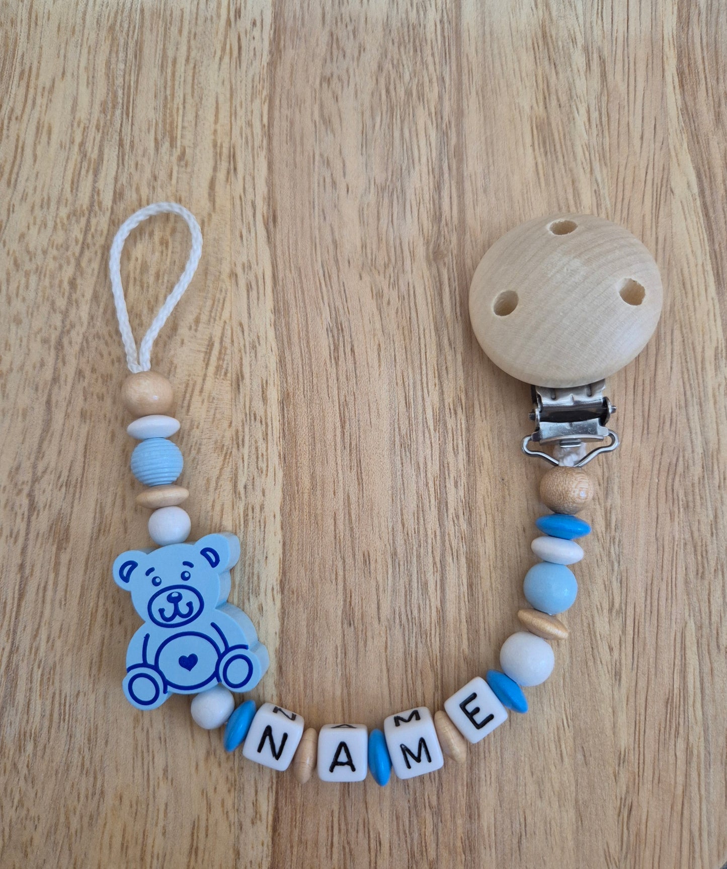 Handgemachte Schnullerkette Bär (Rosa, Blau, Natur/Gelb)